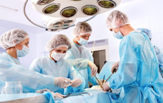 Surgeons performing heart surgery on a patient