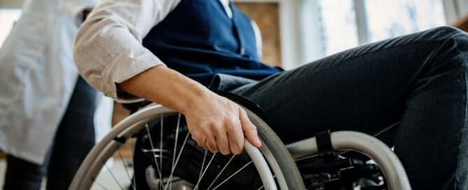 Man in wheelchair with physical disability post accident